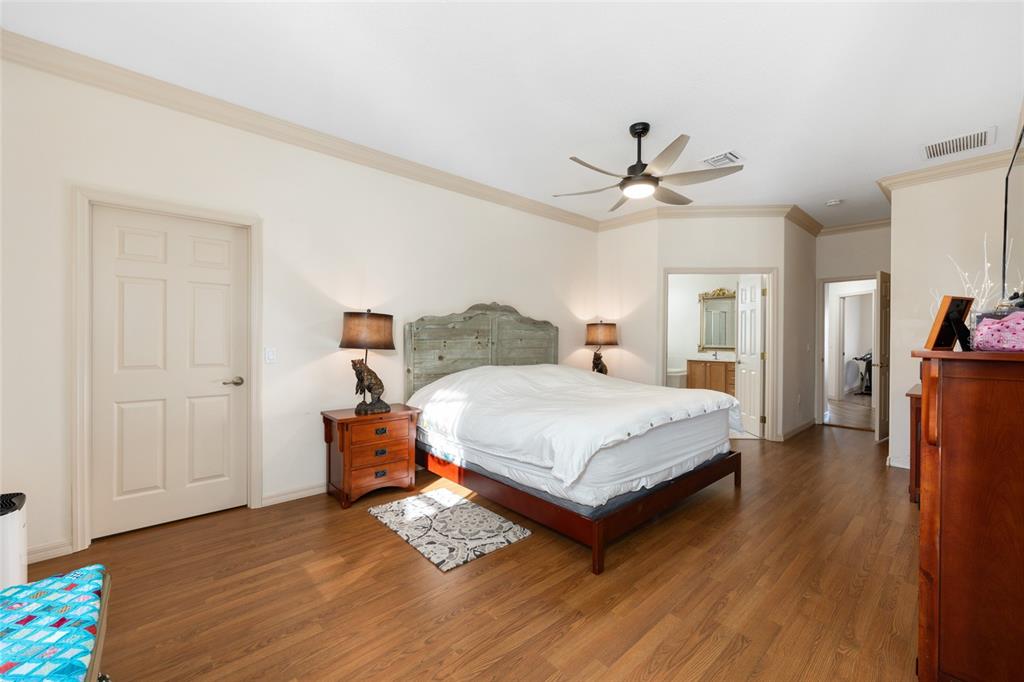 15694 Southwest 16th Avenue Road Ocala, FL 34473 - Photo 20 of 42 a bedroom with a bed and wooden floor