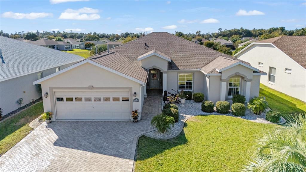 15694 Southwest 16th Avenue Road Ocala, FL 34473 - Photo 3 of 42 a front view of a house with garden