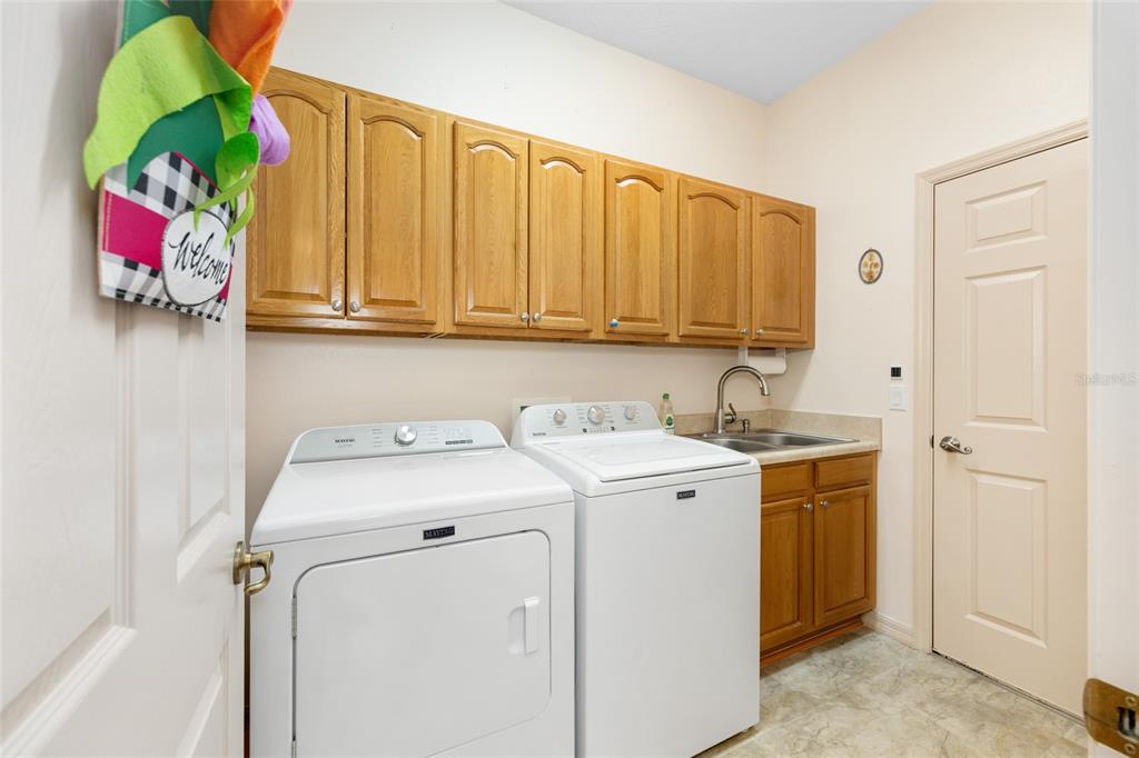15694 Southwest 16th Avenue Road Ocala, FL 34473 - Photo 31 of 42 a utility room with dryer and washer