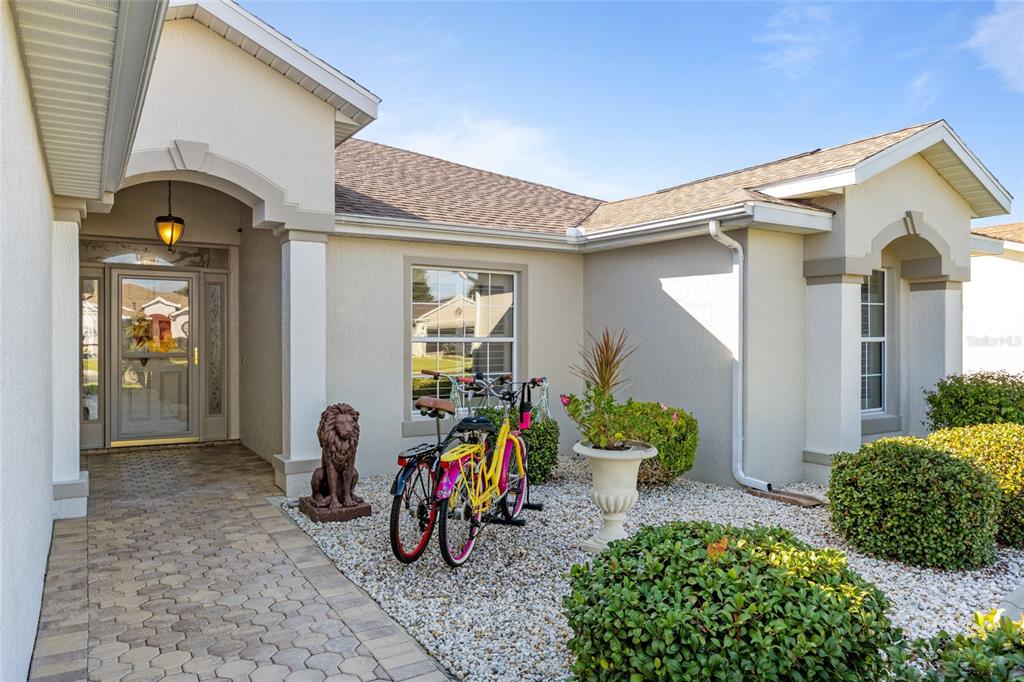 15694 Southwest 16th Avenue Road Ocala, FL 34473 - Photo 5 of 42 a view of a house with wooden roof and potted plants