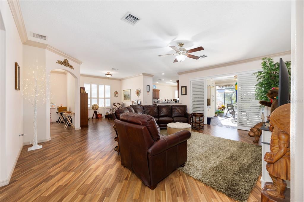 15694 Southwest 16th Avenue Road Ocala, FL 34473 - Photo 10 of 42 a living room with furniture and wooden floor