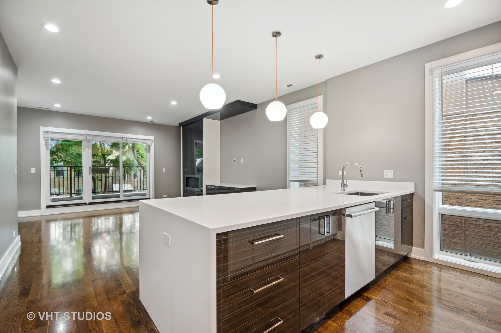 1741 West Roscoe Street, Unit 2 Chicago, IL 60657 - Photo 11 of 24 a large kitchen with kitchen island a large island in it