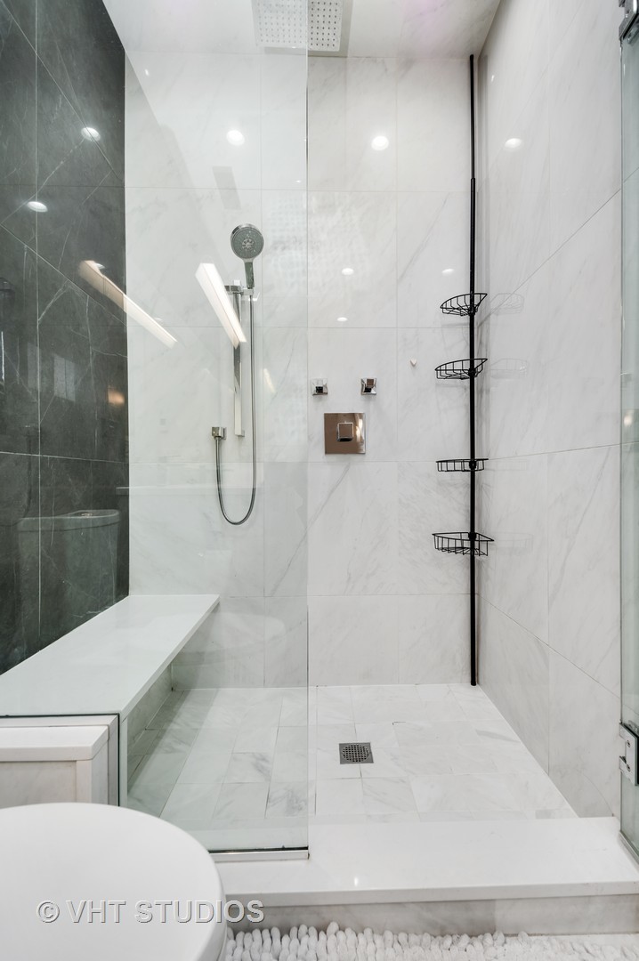 1741 West Roscoe Street, Unit 2 Chicago, IL 60657 - Photo 16 of 24 a bathroom with a shower