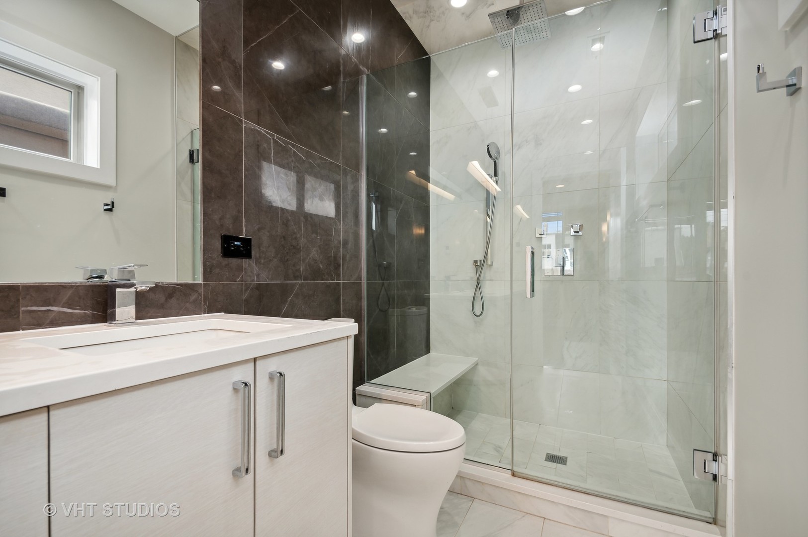 1741 West Roscoe Street, Unit 2 Chicago, IL 60657 - Photo 18 of 24 a bathroom with a sink a toilet and shower