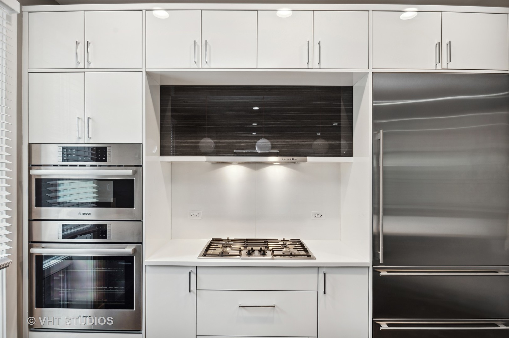 1741 West Roscoe Street, Unit 2 Chicago, IL 60657 - Photo 6 of 24 a stove top oven sitting inside of a kitchen