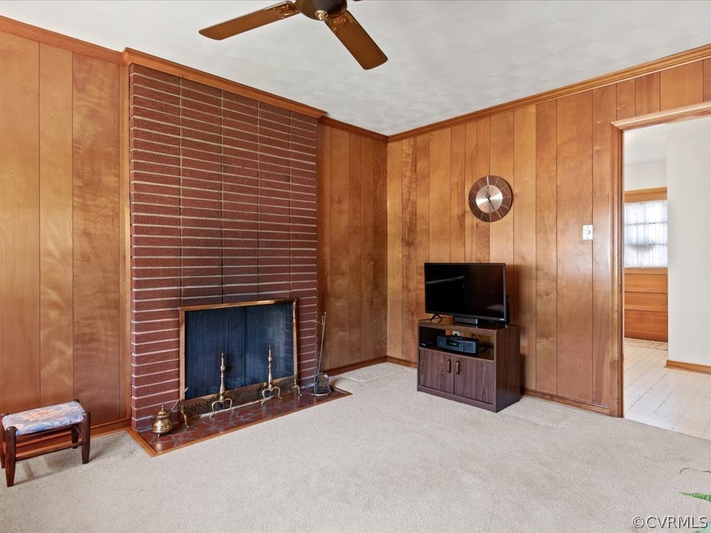 6401 Commander Road Richmond, VA 23224 - Photo 18 of 19 a living room with furniture a flat screen tv and a fireplace