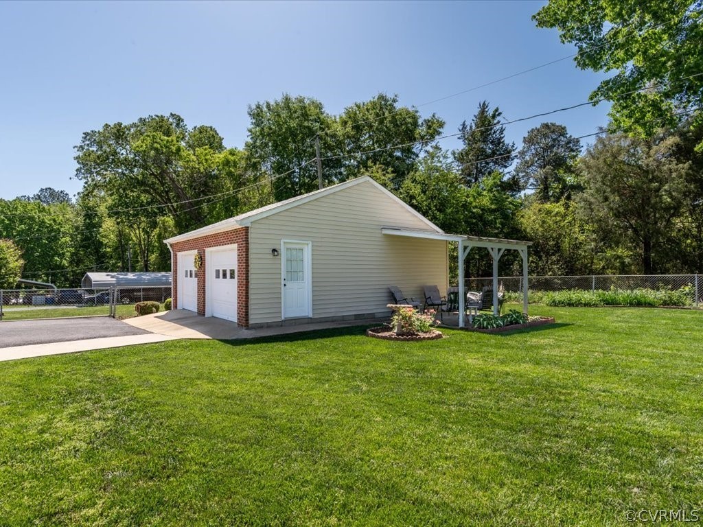 6401 Commander Road Richmond, VA 23224 - Photo 4 of 19 a view of a house with a yard and sitting area