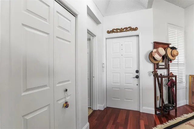 a view of hallway with wooden floor