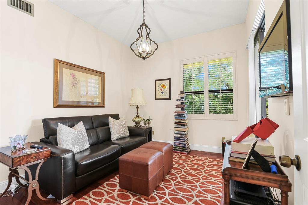 7535 La Paz Boulevard, Unit 301 Boca Raton, FL 33433 - Photo 28 of 42 a living room with furniture and a window