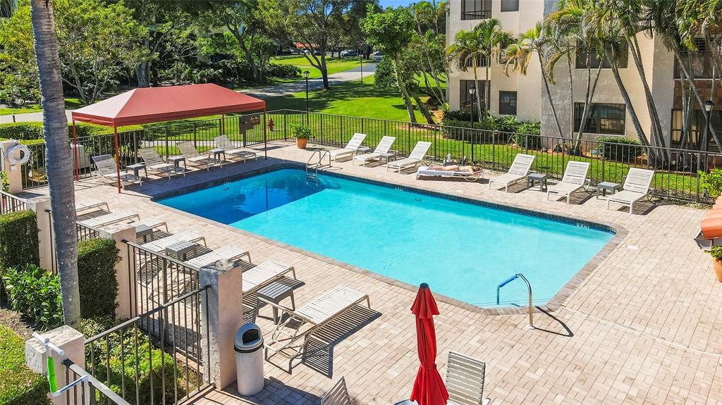 7535 La Paz Boulevard, Unit 301 Boca Raton, FL 33433 - Photo 36 of 42 a view of a swimming pool with a patio