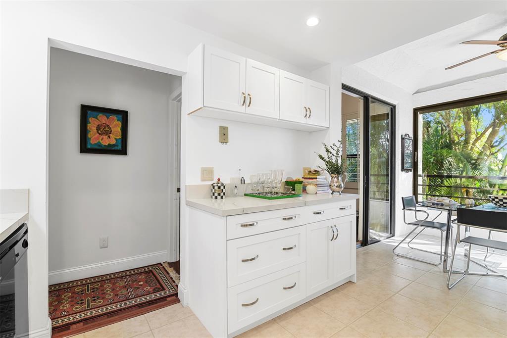 7535 La Paz Boulevard, Unit 301 Boca Raton, FL 33433 - Photo 4 of 42 a room with cabinets and a open kitchen area