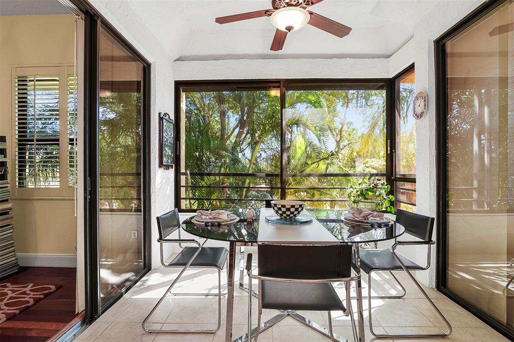7535 La Paz Boulevard, Unit 301 Boca Raton, FL 33433 - Photo 6 of 42 a living room with large windows