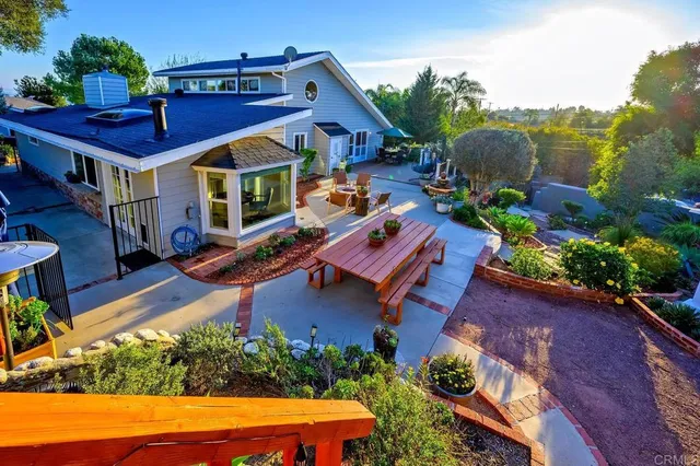 a view of a house with sitting area and furniture