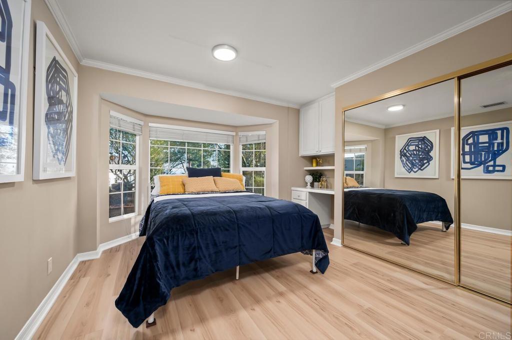 2469 East Mission Road Fallbrook, CA 92028 - Photo 14 of 32 a bedroom with a large bed and a couch