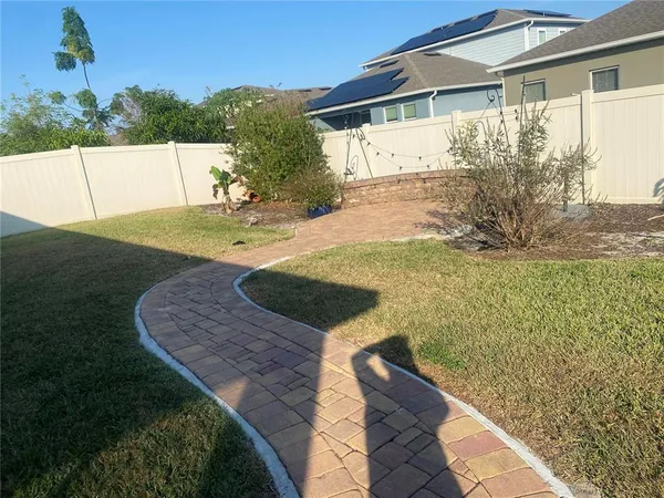 a view of a back yard of the house