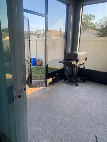 a bedroom with furniture and a large window