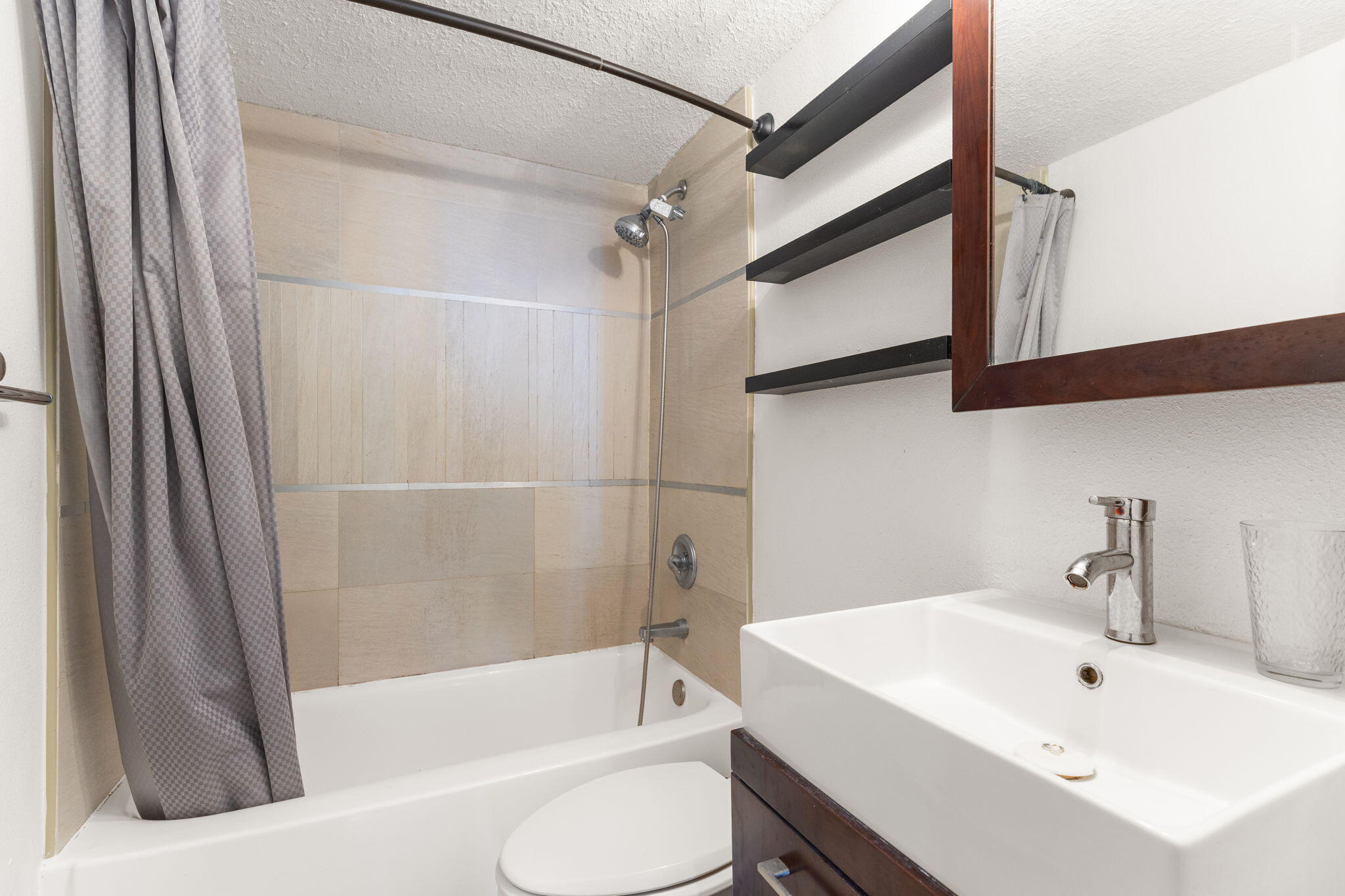 1500 Bay Road, Unit 1122S Miami Beach, FL 33139 - Photo 12 of 24 a bathroom with a sink and a bathtub