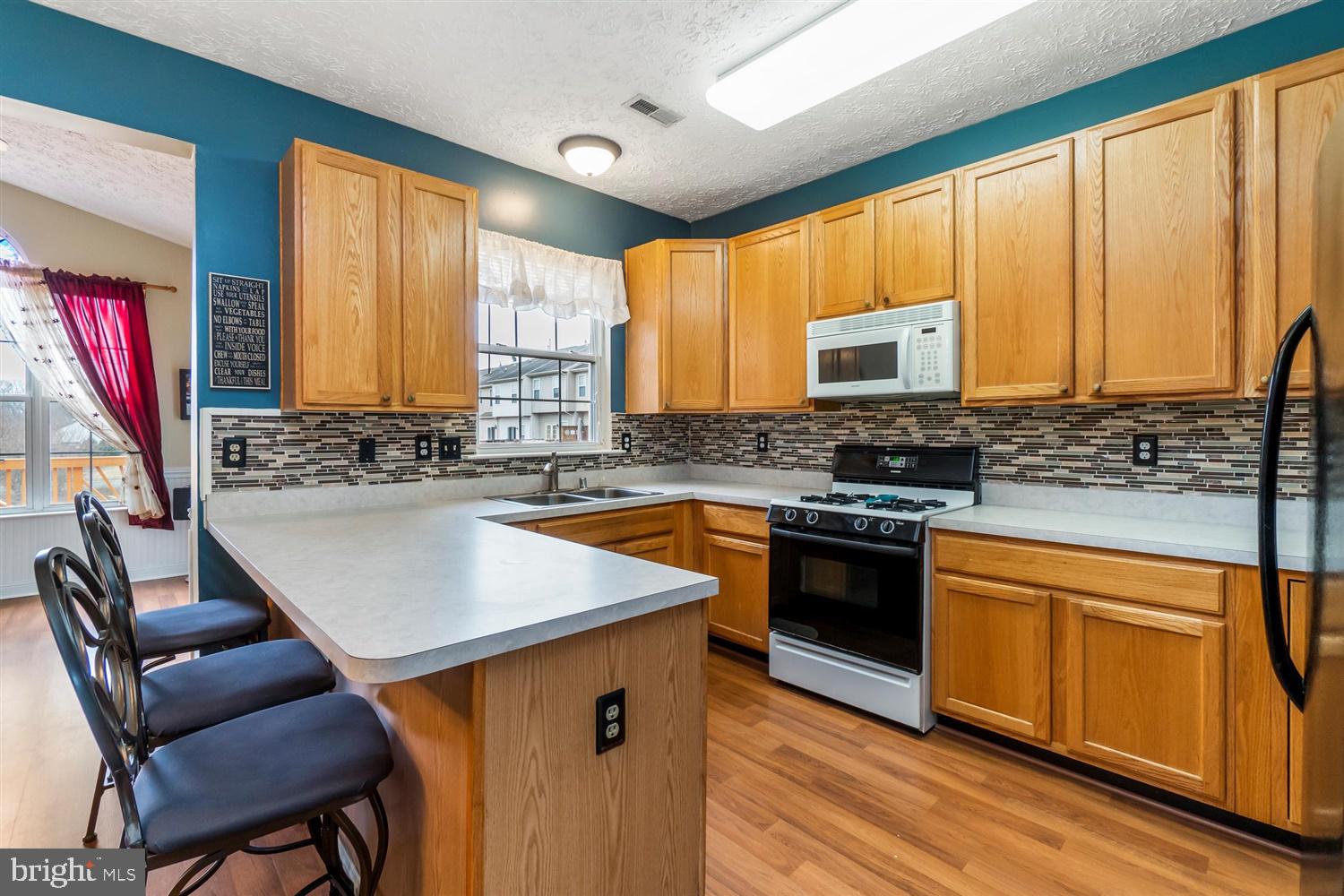 1413 Roman Ridge Way Bel Air, MD 21014 - Photo 8 of 33 Kitchen featuring tiled backsplash