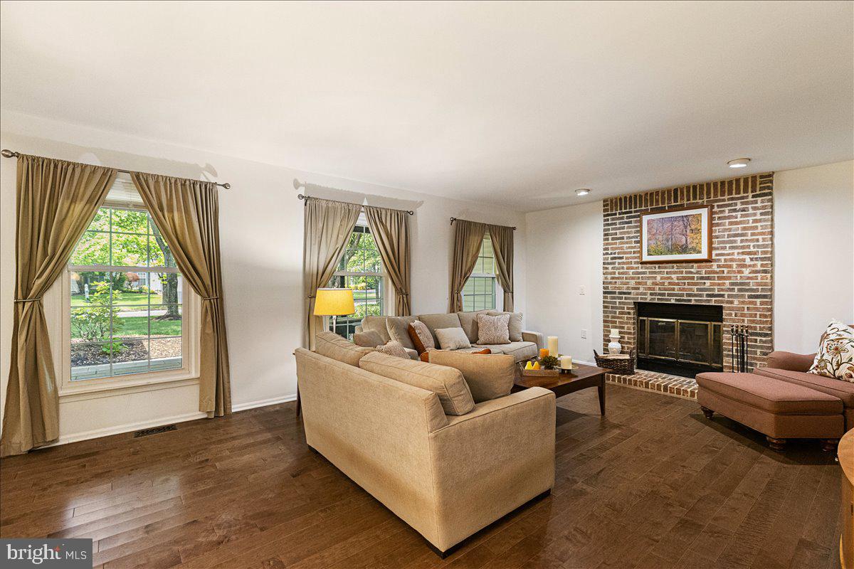 3 Strathmore Place Princeton Junction, NJ 08550 - Photo 6 of 29 a living room with furniture and a fireplace