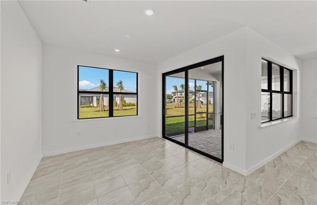 3922 East Hampton Circle Fort Myers, FL 33905 - Photo 12 of 24 a view of an empty room with glass door and balcony