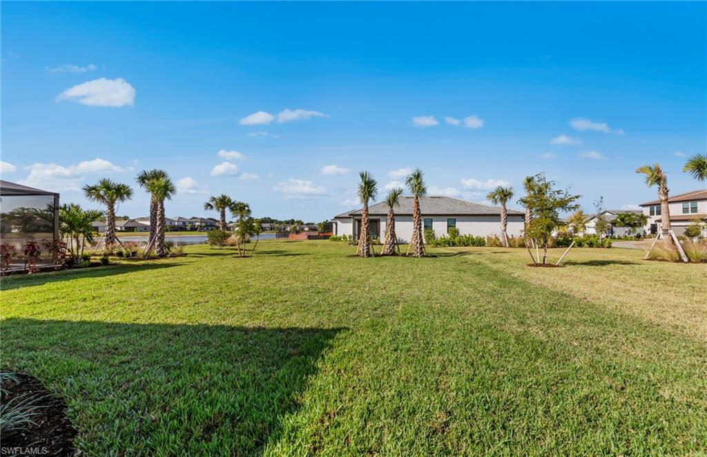 3922 East Hampton Circle Fort Myers, FL 33905 - Photo 24 of 24 a view of outdoor space with garden and lots of swings and slides