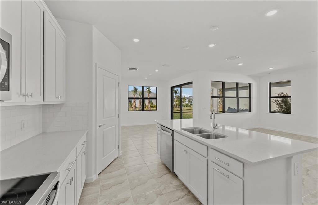 3922 East Hampton Circle Fort Myers, FL 33905 - Photo 9 of 24 a kitchen with counter top space and sink
