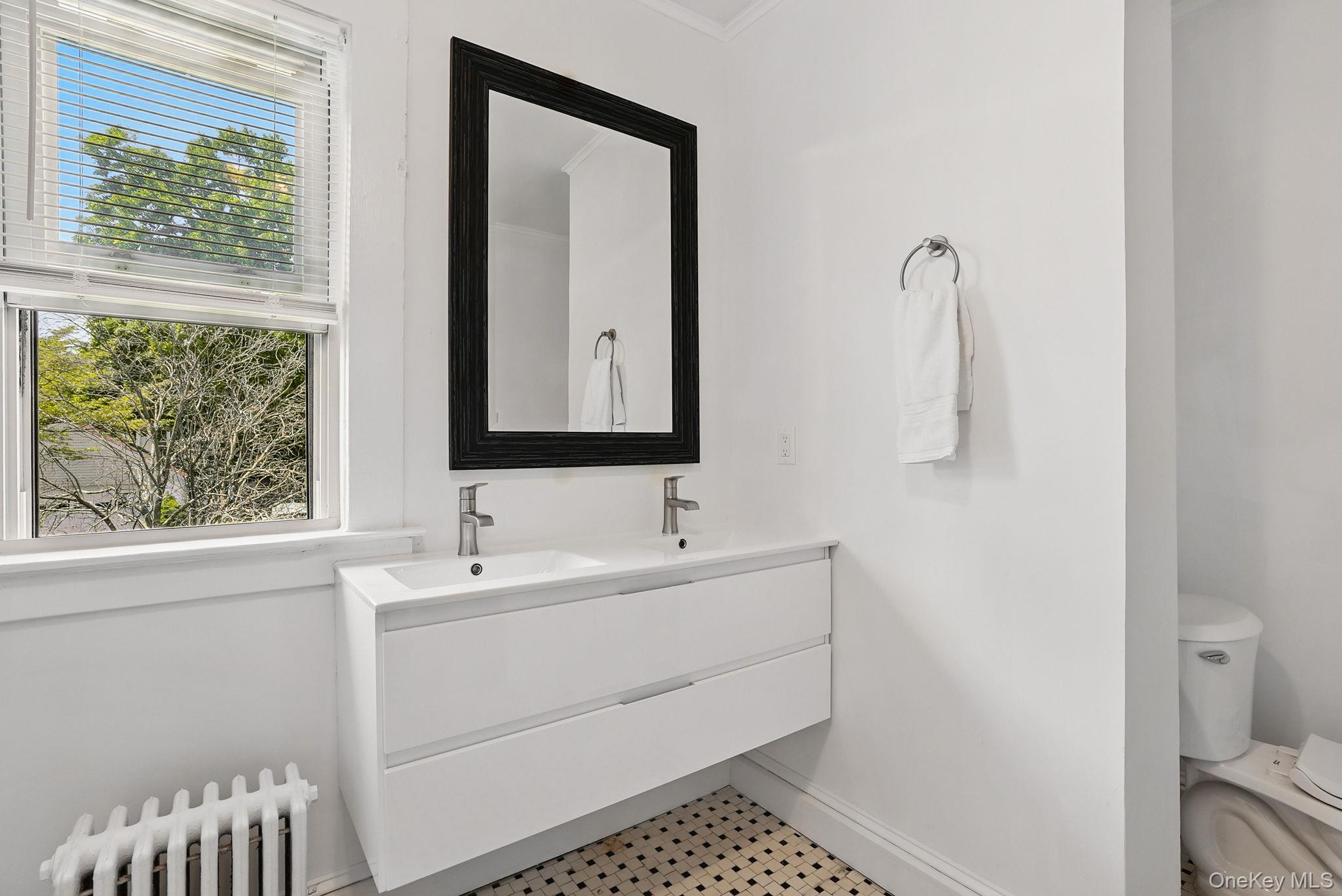 134 Old Mamaroneck Road White Plains, NY 10605 - Photo 13 of 23 a bathroom with a sink and a mirror