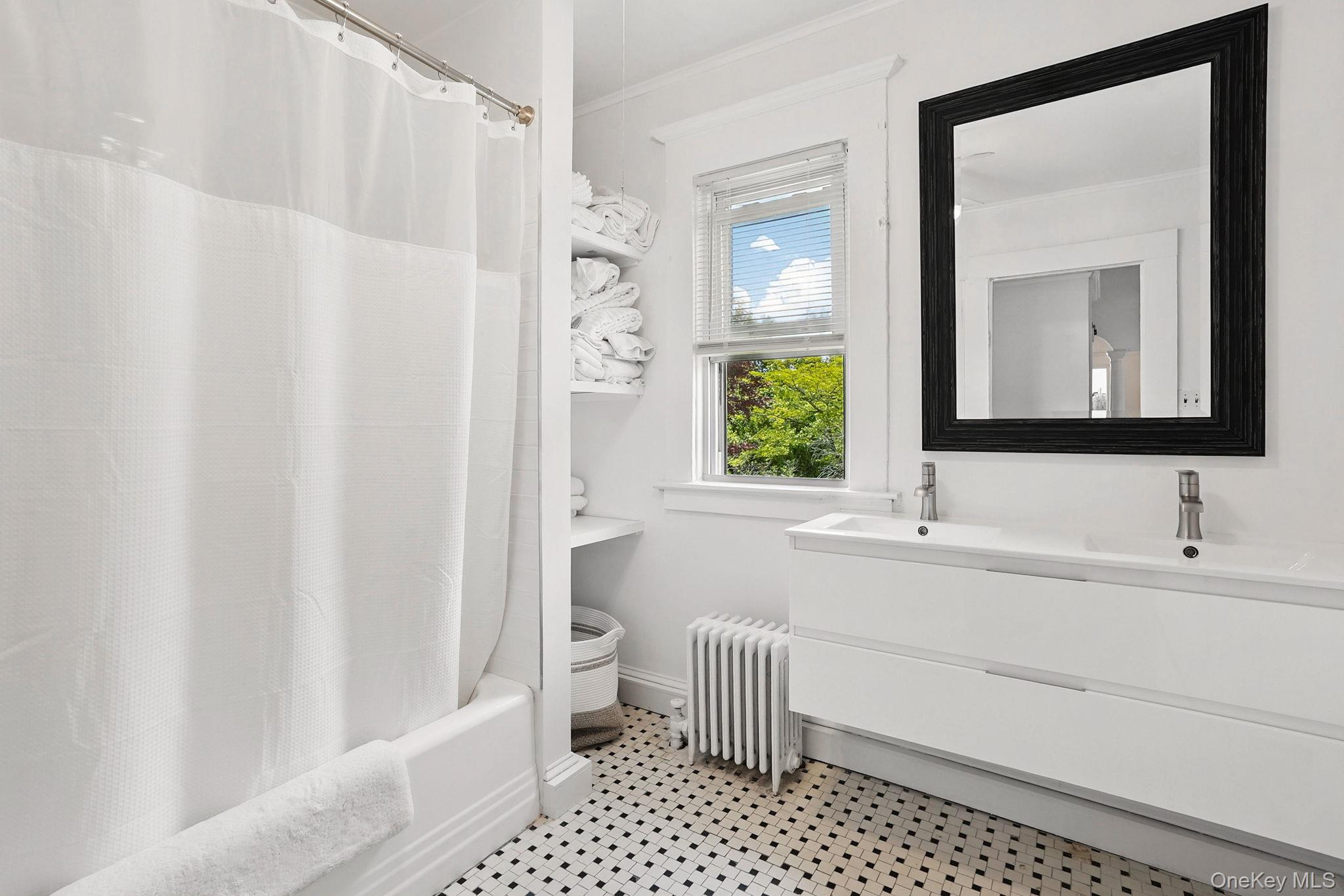 134 Old Mamaroneck Road White Plains, NY 10605 - Photo 14 of 23 a bathroom with a sink a toilet and a mirror