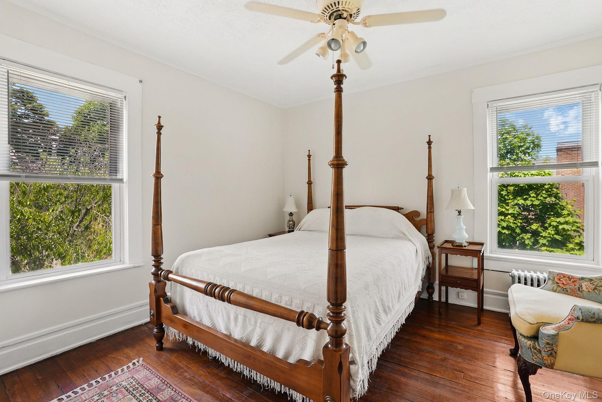134 Old Mamaroneck Road White Plains, NY 10605 - Photo 16 of 23 a bed sitting in a bedroom next to a window
