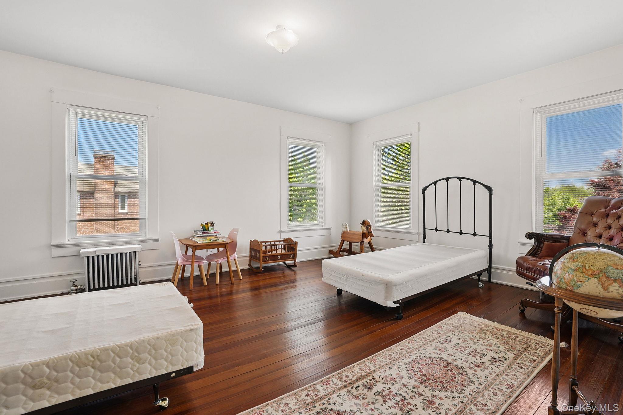 134 Old Mamaroneck Road White Plains, NY 10605 - Photo 17 of 23 a living room with furniture wooden floor and window