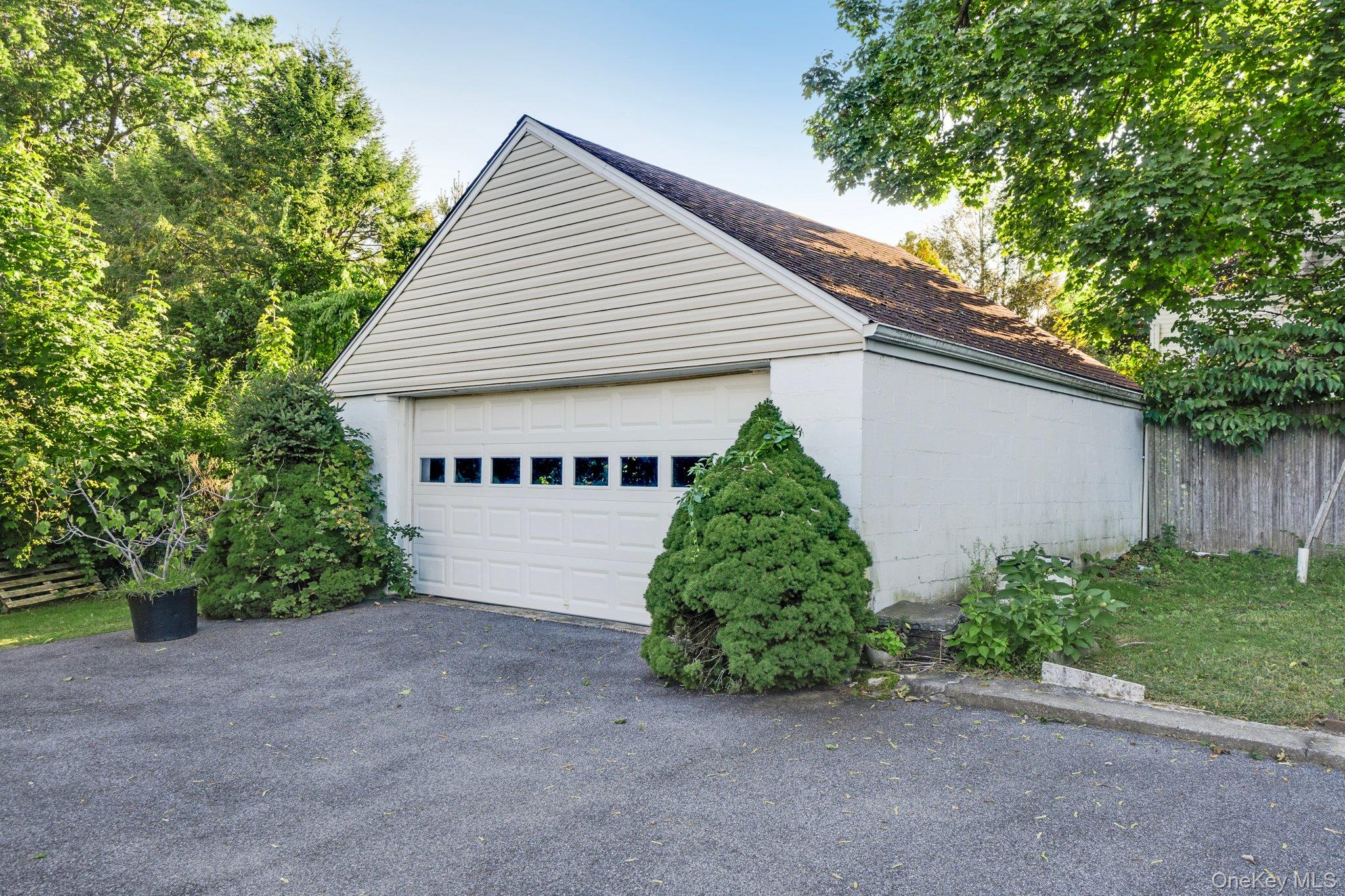 134 Old Mamaroneck Road White Plains, NY 10605 - Photo 19 of 23 a view of a house with a yard and potted plants