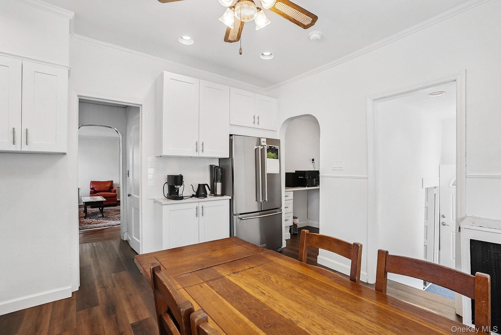 134 Old Mamaroneck Road White Plains, NY 10605 - Photo 4 of 23 a kitchen with stainless steel appliances granite countertop a refrigerator a stove and a wooden floors