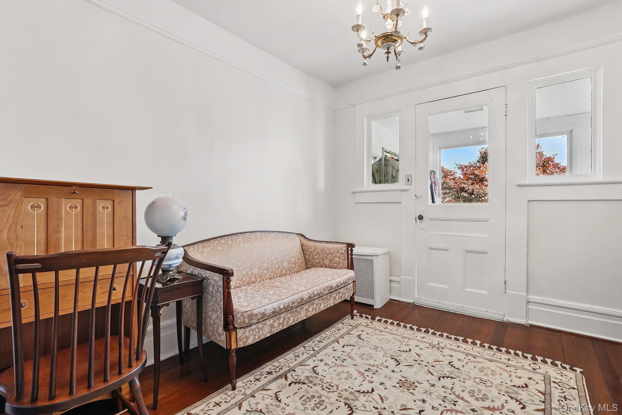 134 Old Mamaroneck Road White Plains, NY 10605 - Photo 10 of 23 a living room with furniture and a rug
