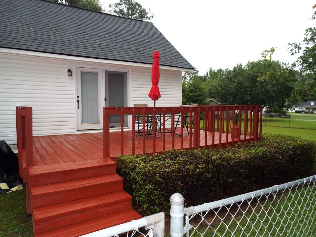 204 Ridge Court Macon, GA 31216 - Photo 22 of 25 a view of a wooden deck with a yard