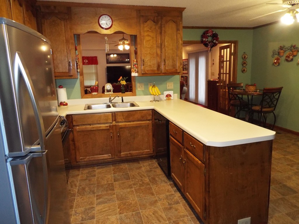 204 Ridge Court Macon, GA 31216 - Photo 8 of 25 a kitchen with a sink a stove top oven and cabinetry