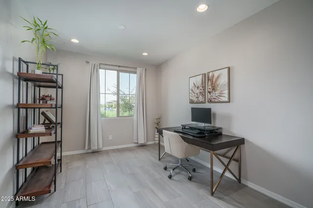 a kitchen with a refrigerator a sink and a stove top oven