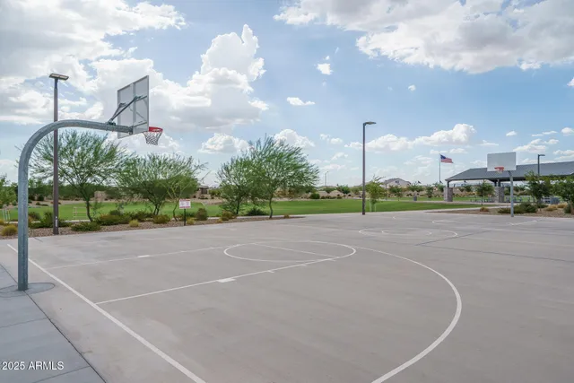an aerial view of a swimming pool with a lake view