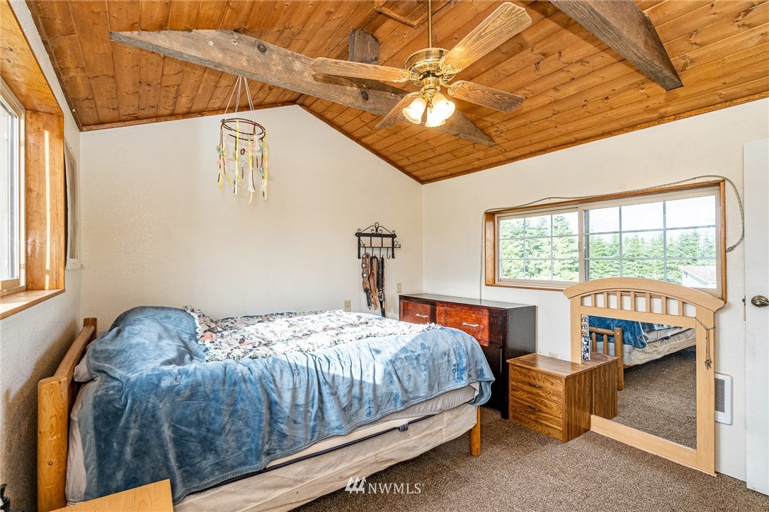 202 Holcomb Road Chehalis, WA 98532 - Photo 14 of 20 a bedroom with a bed and a large window
