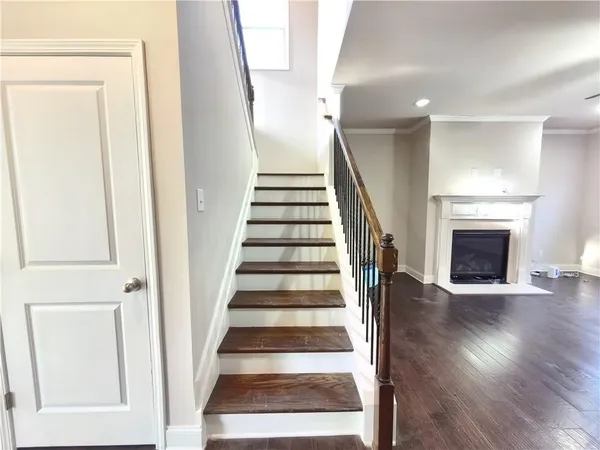 a view of wooden floor and windows in a room