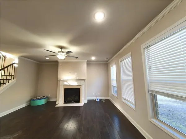 a room with kitchen island furniture and a wooden floor