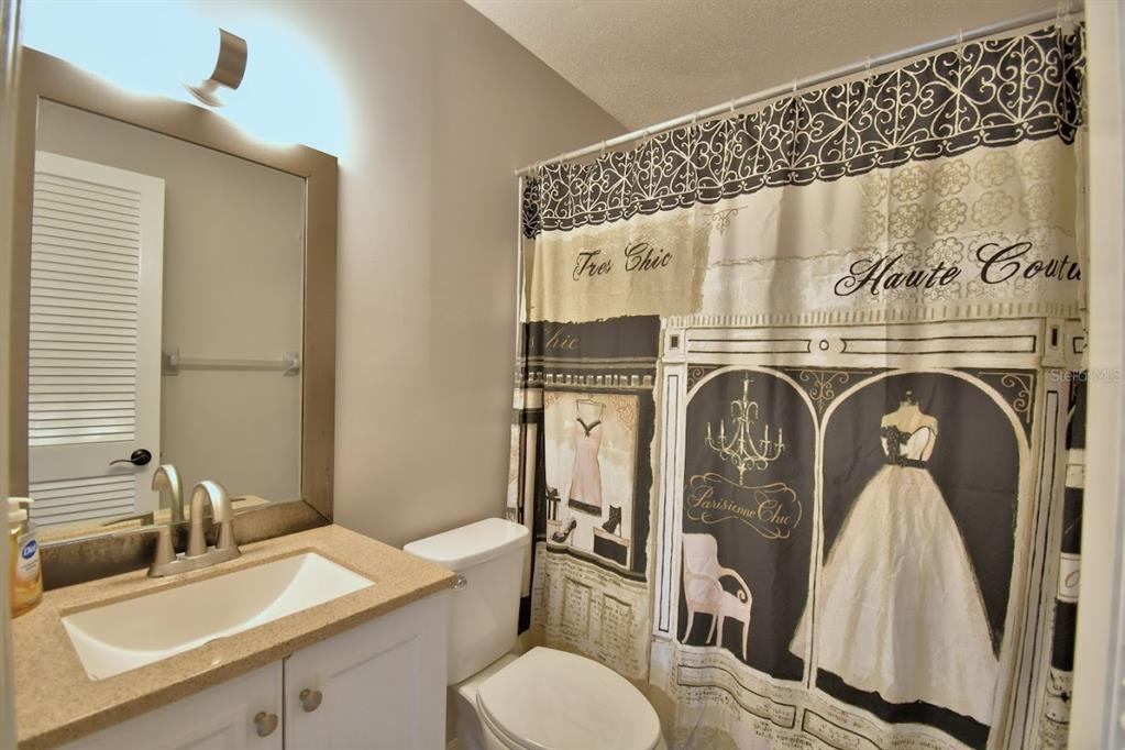 1920 East Edgewood Drive, Unit R8 Lakeland, FL 33803 - Photo 15 of 30 a bathroom with a sink and a mirror