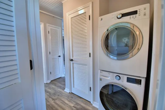 a view of a hallway with washer and dryer