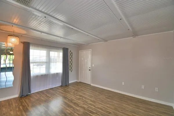 a view of an empty room and window