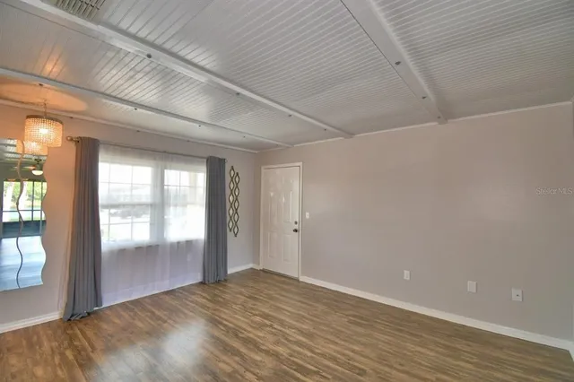 a view of an empty room and window