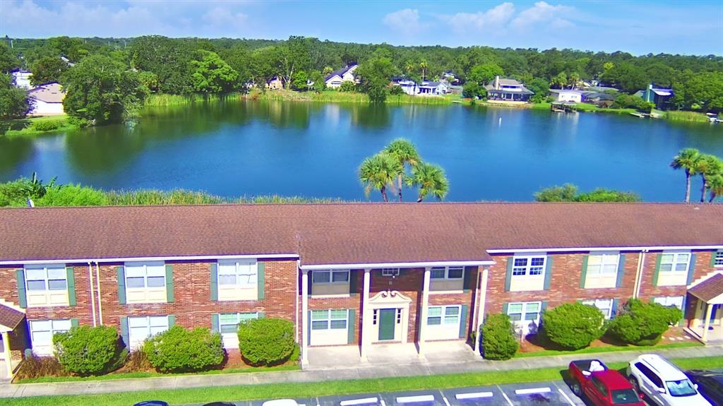 1920 East Edgewood Drive, Unit R8 Lakeland, FL 33803 - Photo 24 of 30 a aerial view of a house with a yard and outdoor seating