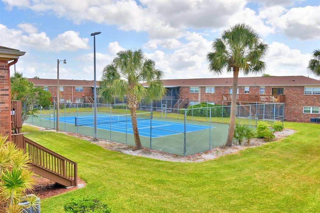 1920 East Edgewood Drive, Unit R8 Lakeland, FL 33803 - Photo 28 of 30 a view of a garden with a slide