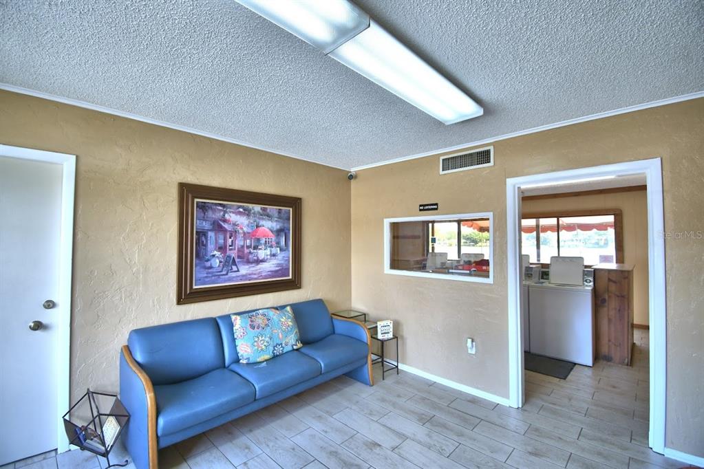1920 East Edgewood Drive, Unit R8 Lakeland, FL 33803 - Photo 30 of 30 a view of livingroom with furniture and windows