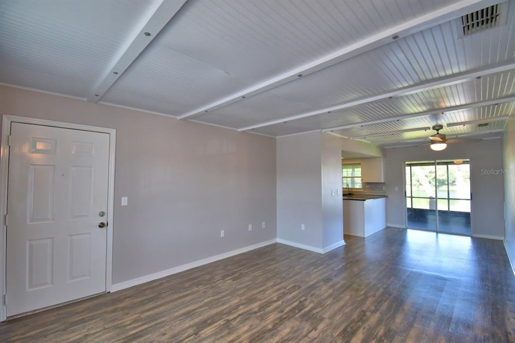1920 East Edgewood Drive, Unit R8 Lakeland, FL 33803 - Photo 4 of 30 a view of interior space with wooden floor and windows