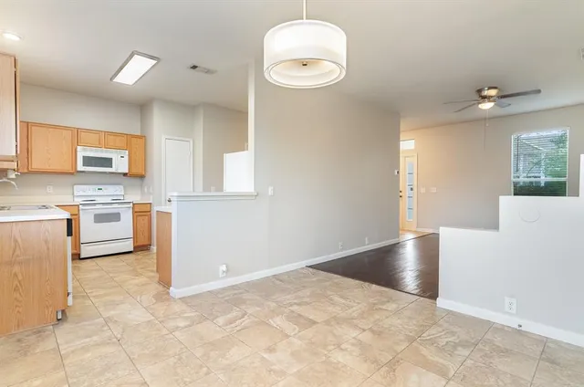 a view of a kitchen with furniture and a window