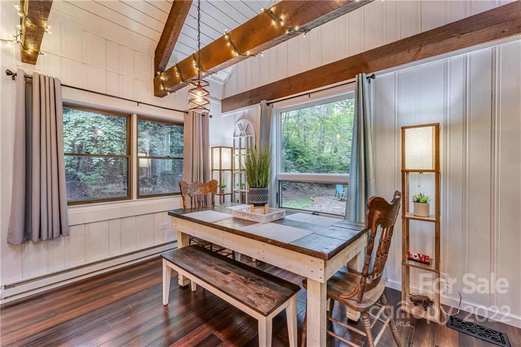 1305 Old Balsam Road Waynesville, NC 28786 - Photo 15 of 42 a outdoor dining space with furniture and windows